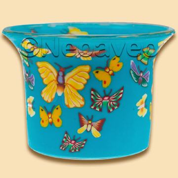 Leucht-Teelichtglas Schmetterlinge mit buntem Sommermotiv. Bunt--blau leuchtendes Kerzenglas für Teelicht oder LED-Teelicht.